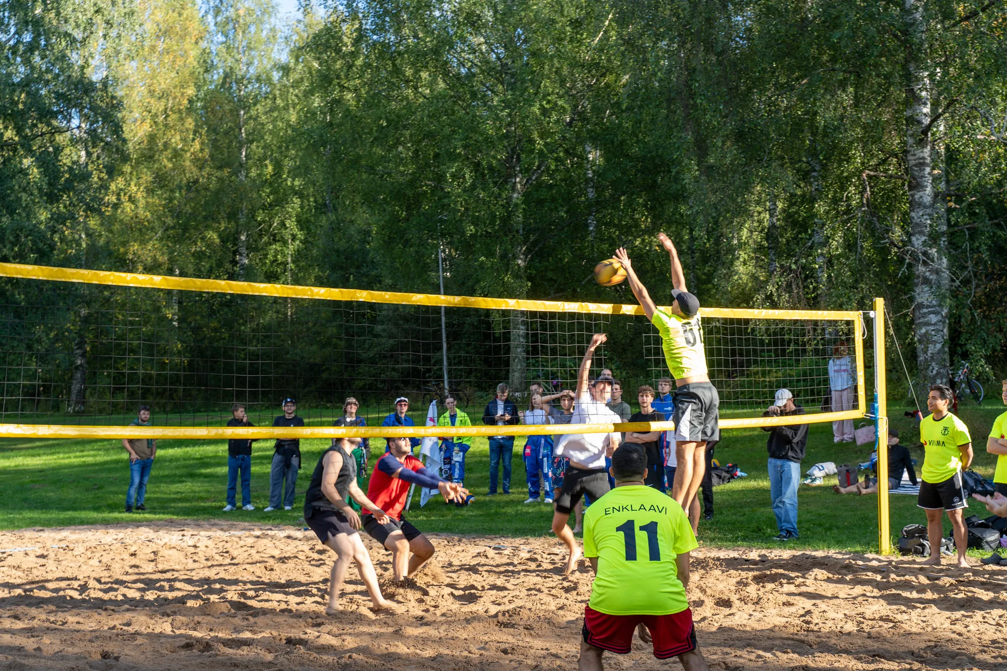 Beach volleyball at the Beach Party, a player hitting the ball over the net