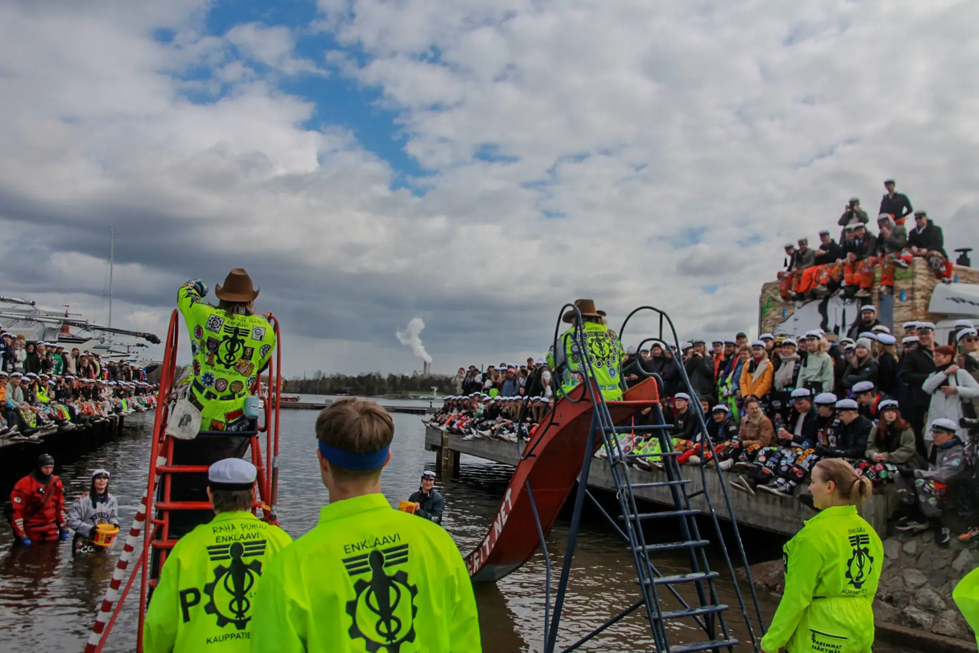Enklaavi members in overalls at the harbour
